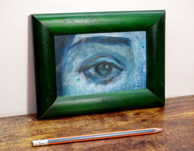 Small framed painting with pencil in the foreground for scale